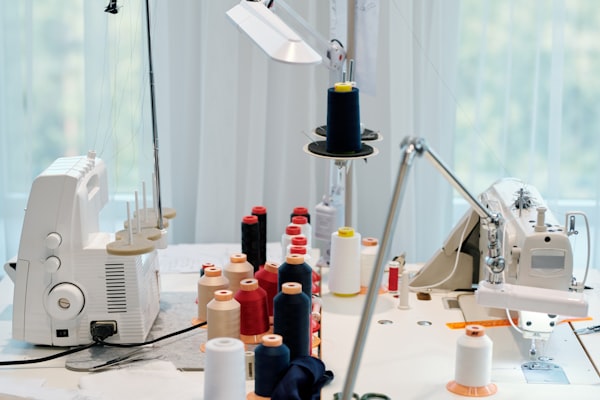Sewing Moon workshop with industrial sewing machines and organized fabric