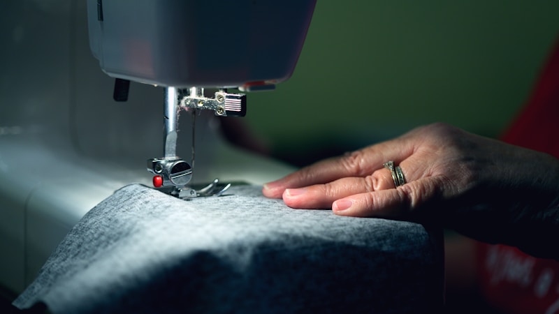 Professional sewing workspace with industrial sewing machine and fabric